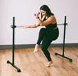 A person lifting weights on a barAI-generated content may be incorrect.