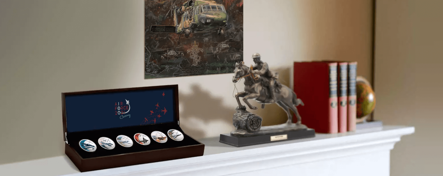 A statue of a person riding a horse next to a box of artDescription automatically generated