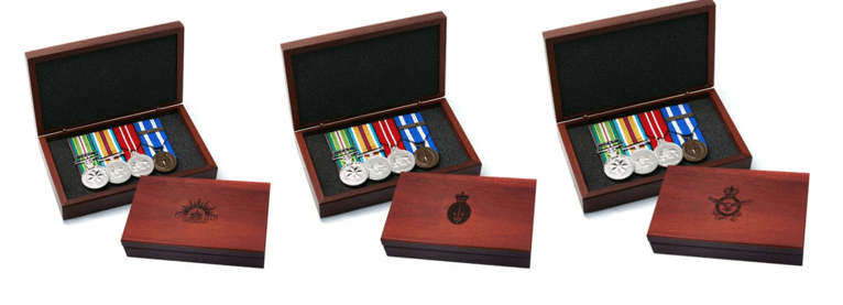 Several wooden boxes with medalsDescription automatically generated