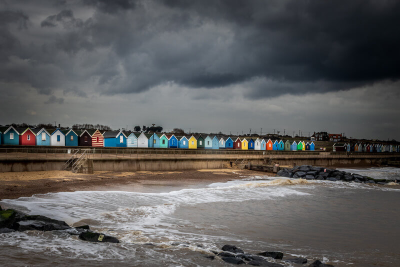 Coloured beach huts on a grey day in Southwold