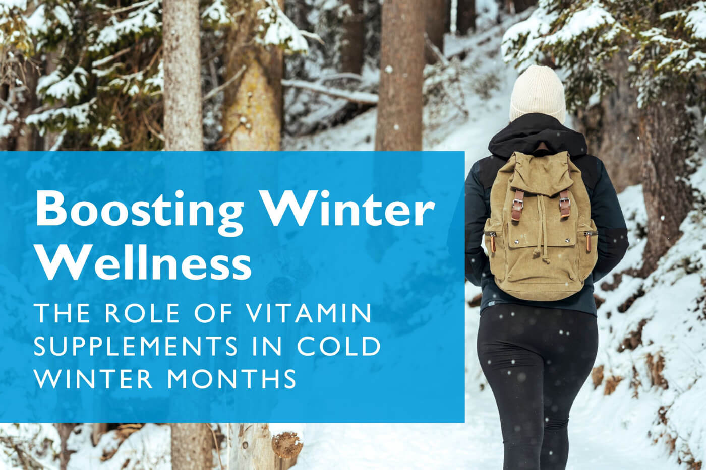 Woman walking in snowy forest | Vitamin Supplements in Cold Months Article | Celebrate Vitamins