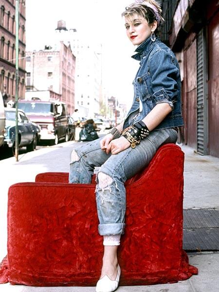 80s fashion madonna wears distressed jeans