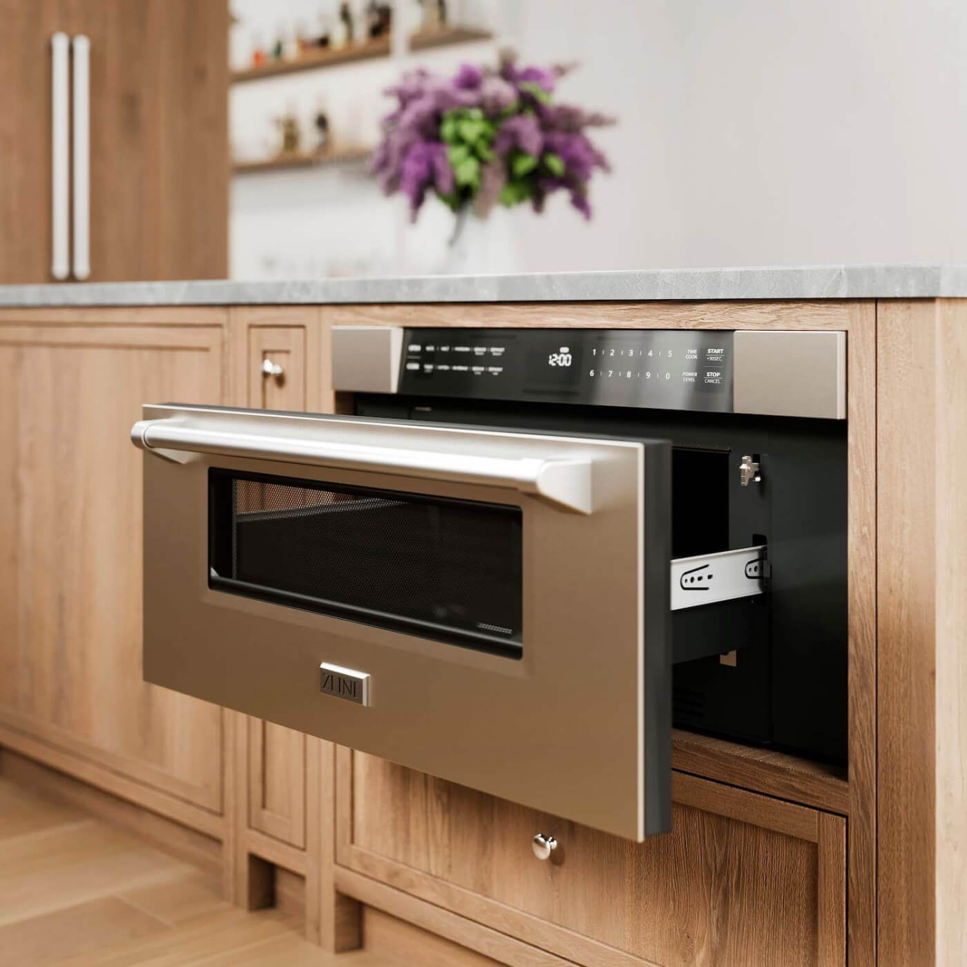 A modern ZLINE 30-inch built-in microwave drawer made of stainless steel, integrated within light wood cabinetry in a stylish kitchen, with a focus on the sleek handle and digital control panel