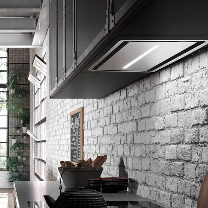 Faber Inca In-Light Range Hood Insert in a contemporary apartment kitchen