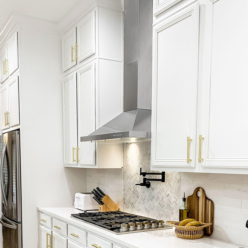 A range hood in a kitchen with a high ceiling