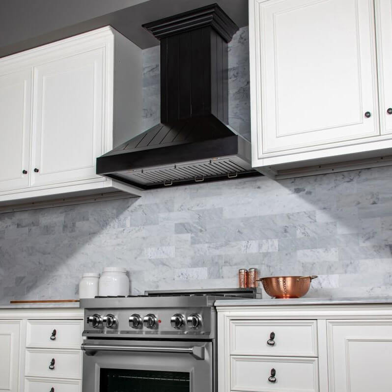 ZLINE KPCC wooden range hood in a kitchen with white cabinets