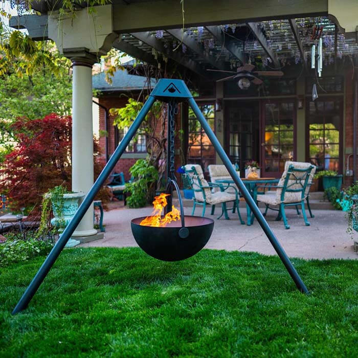 Suspended fire pit in luxury backyard.