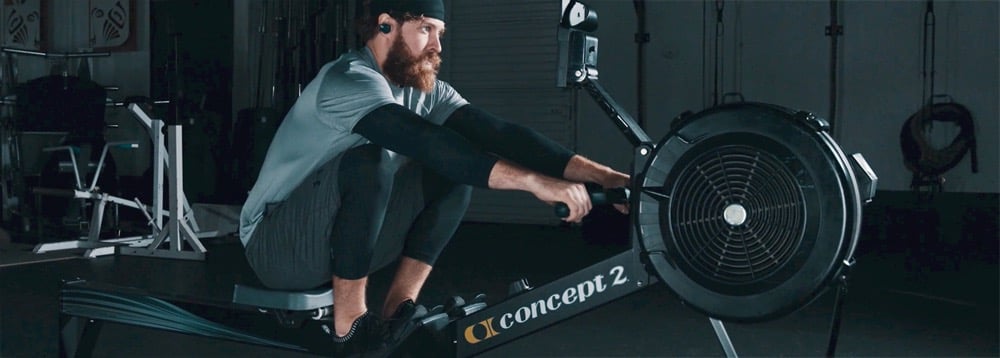 A man on a Concept 2 rowing machine