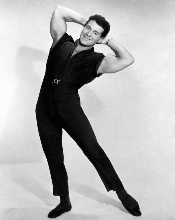 Jack LaLanne poses, showing off his muscles