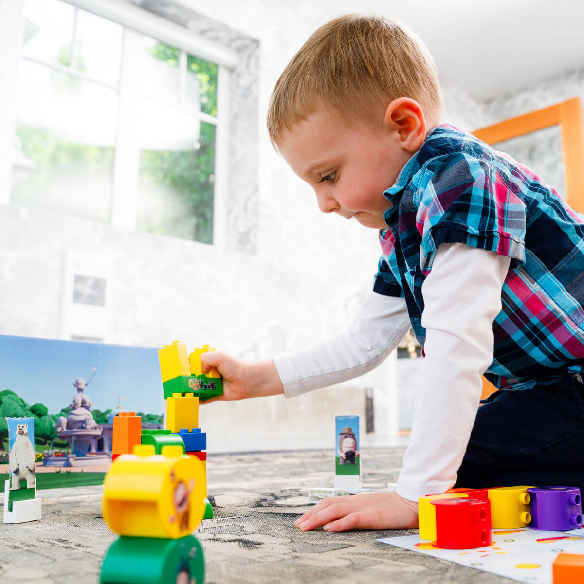 a child playing with toy blocks from oddbods