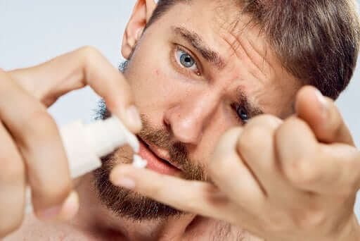 man using beard products with derma roller