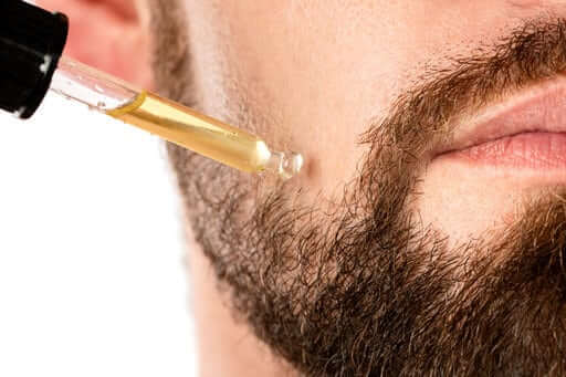 Man using beard oil | Do beard growth kits work?