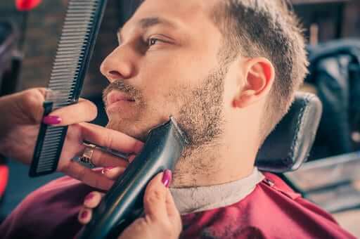 Man getting his beard styled | Why you should save your beard progress