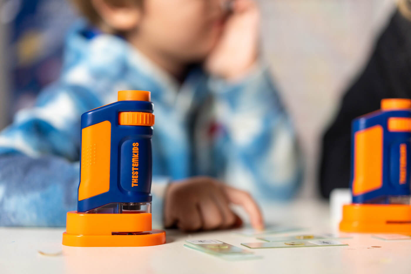 The STEMscope kids microscope featured is an excellent open-ended toy