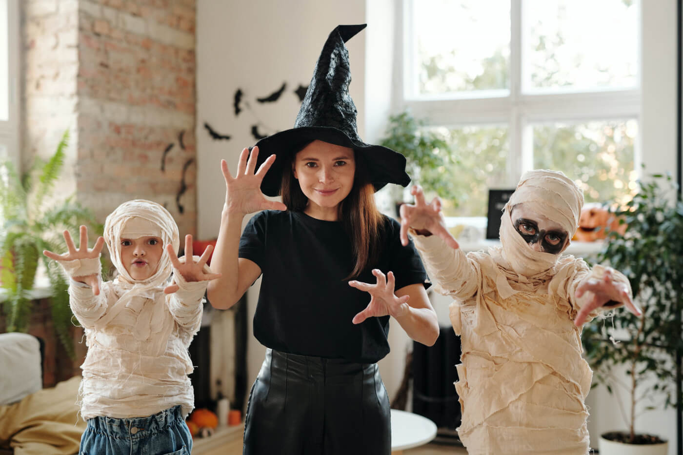 Kids and their mother wearing science fiction Halloween costumes 