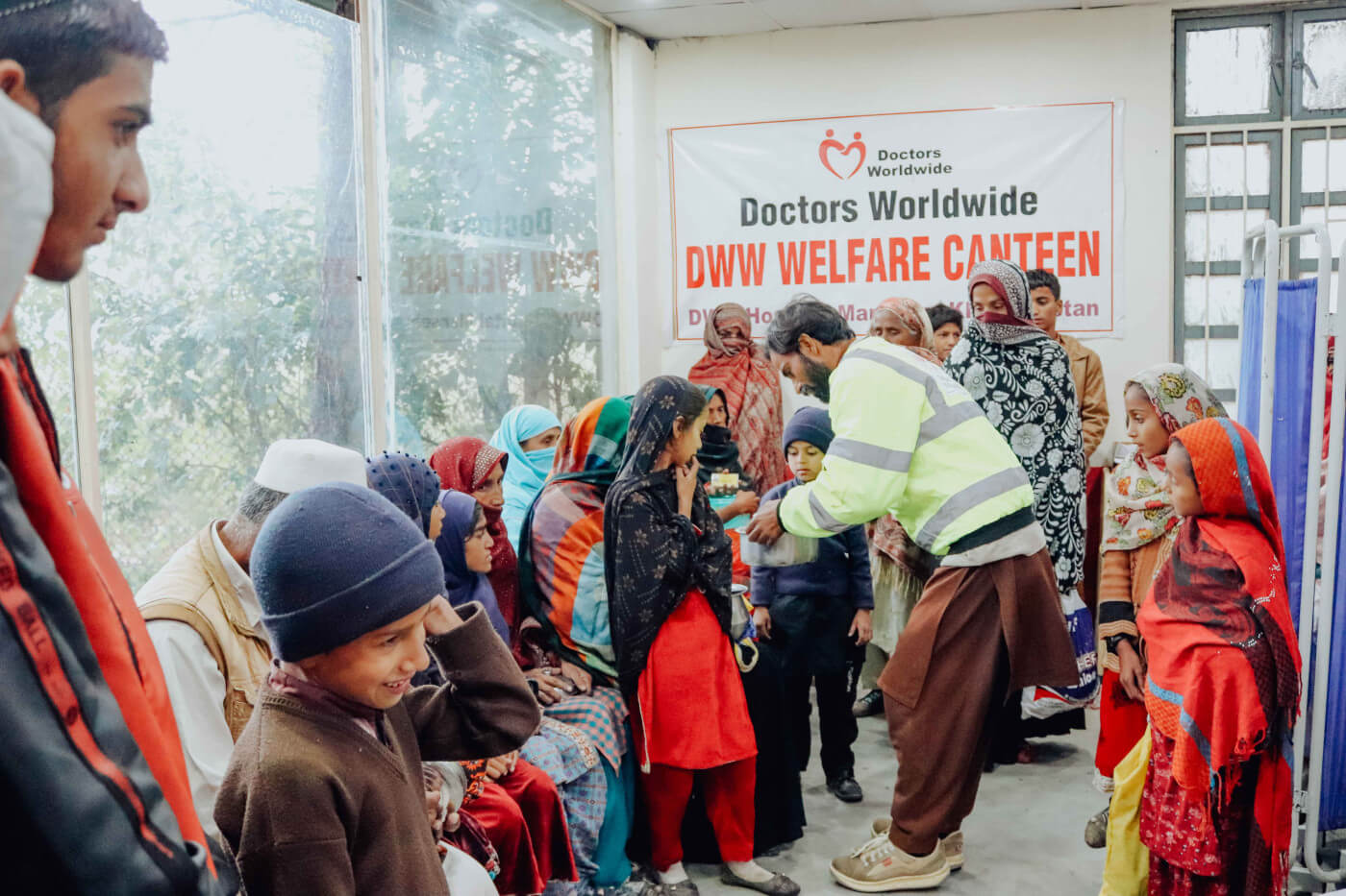 families at doctors worldwide hospital canteen in pakistan receiving food packs and hot meals