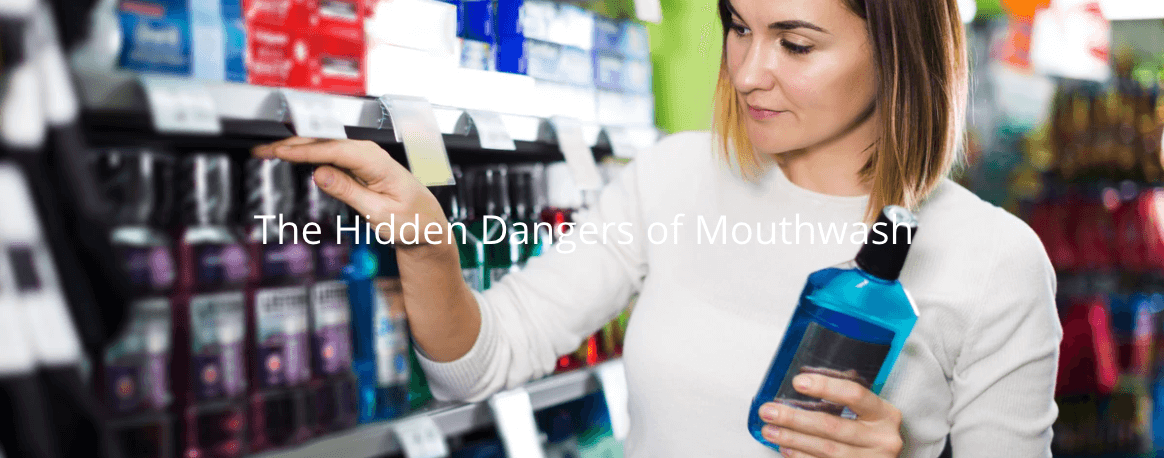 The Hidden Dangers of Mouthwash. Woman comparing various mouthwash brands, clean ingredients.
