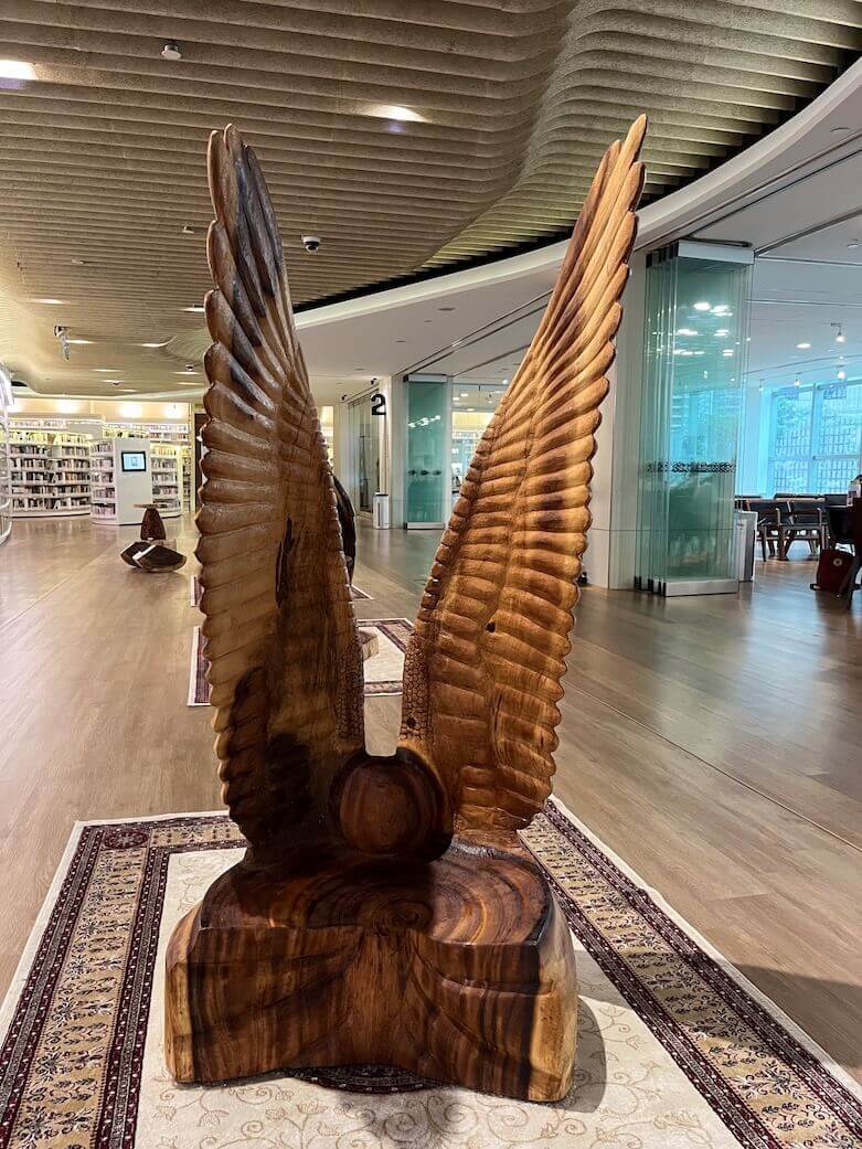 Set Sail is a upcycled wood sculpture with massive wings by Singapore artist Aileen Toh.