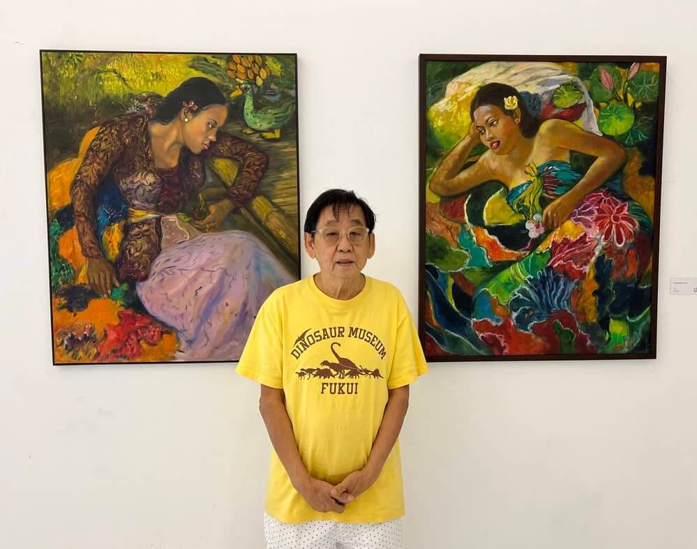 Singapore artist Koeh Sia Yong with his two paintings of titled Balinese Lady.