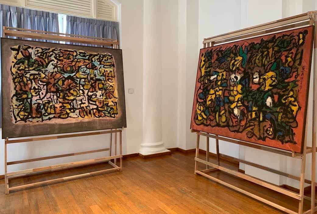 Two of his huge calligraphy paintings on display.