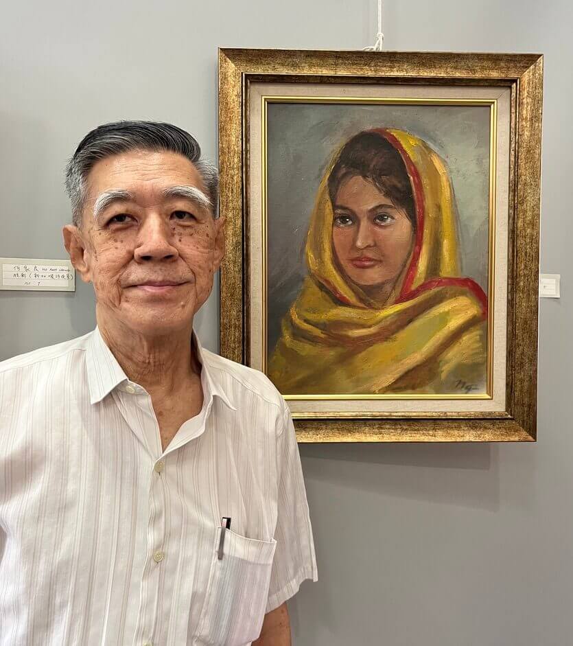 Singapore artist Ng Woon Teck with his portrait oil painting