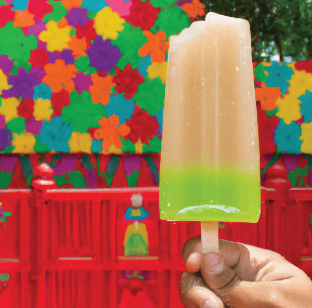 Margarita Mix Popsicle Held by Hand in Mexican Restaurant