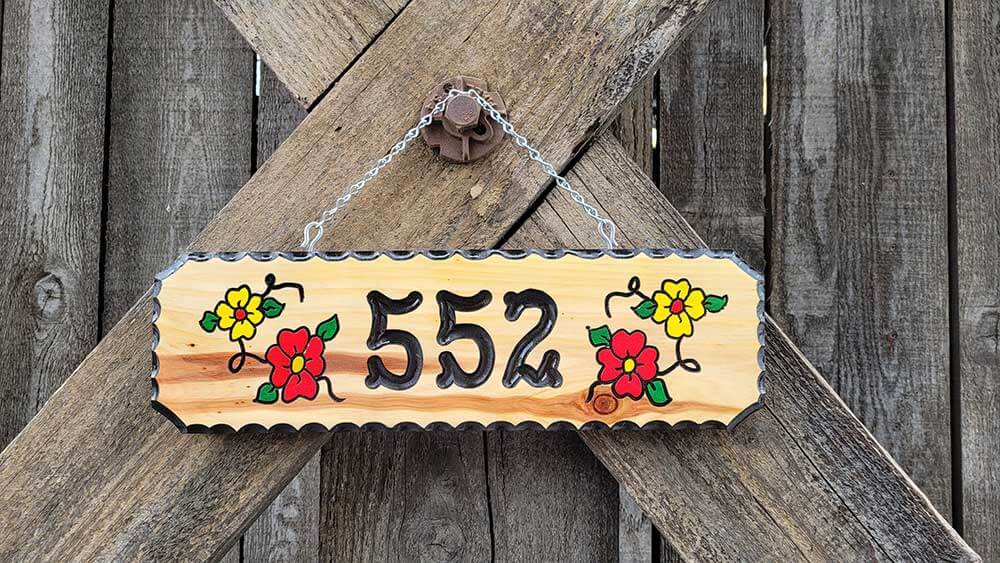 wooden house number signs with flowers