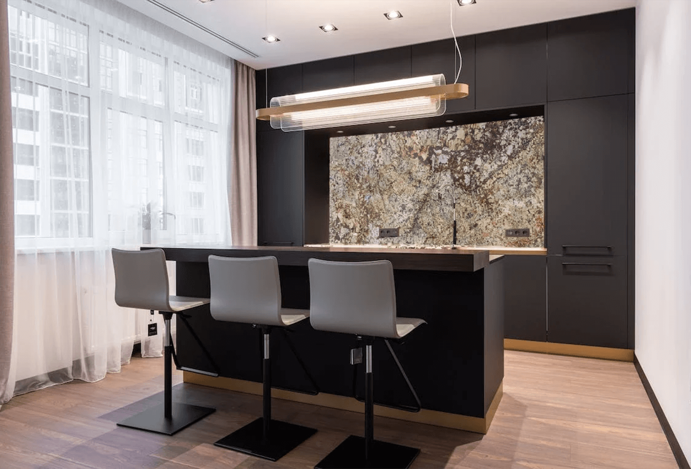 Solarius Granite Backsplash with Dark Base Cabinets