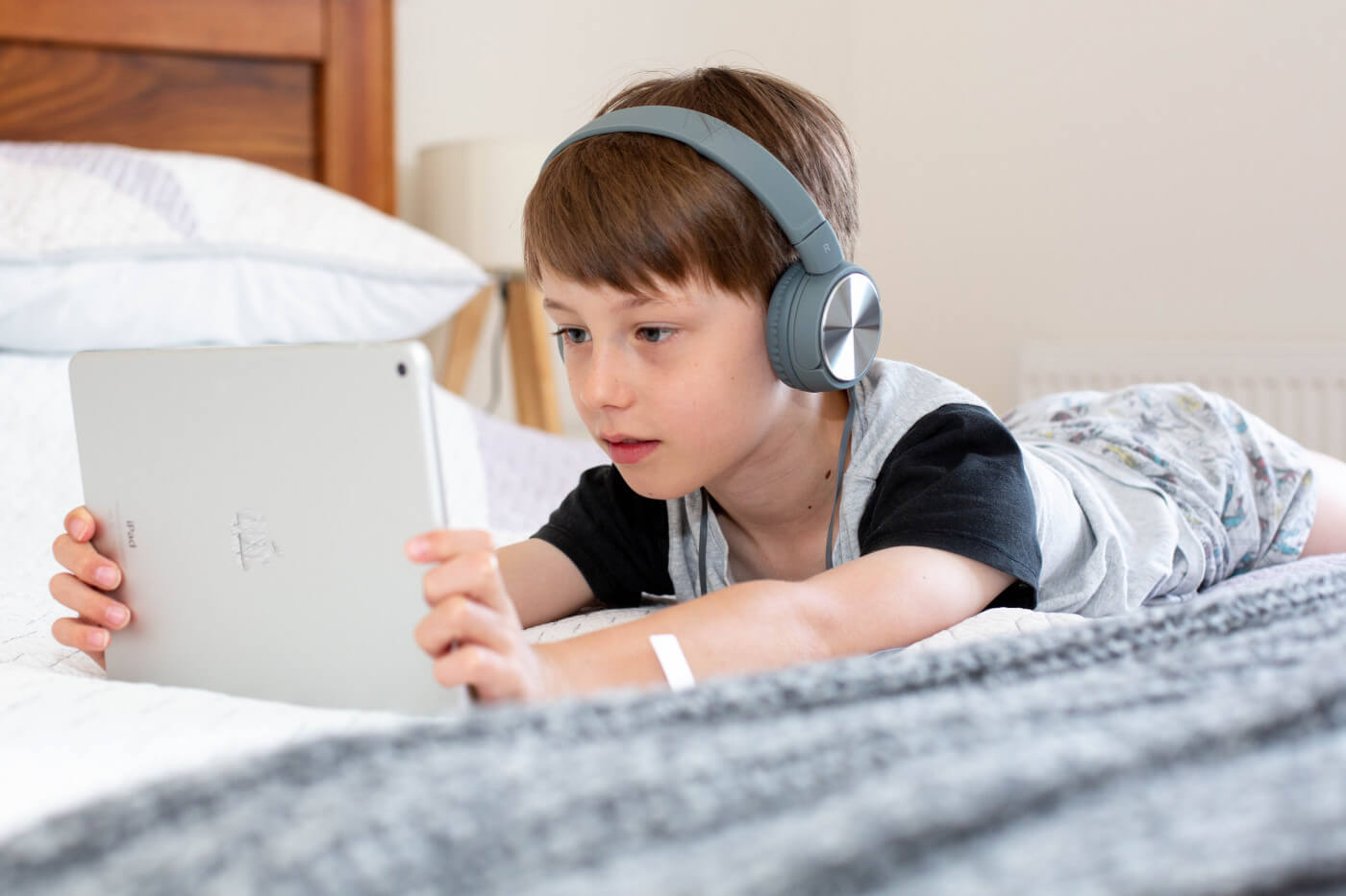 A young boy with auditory learning style, with headphones on Credit: Unsplash