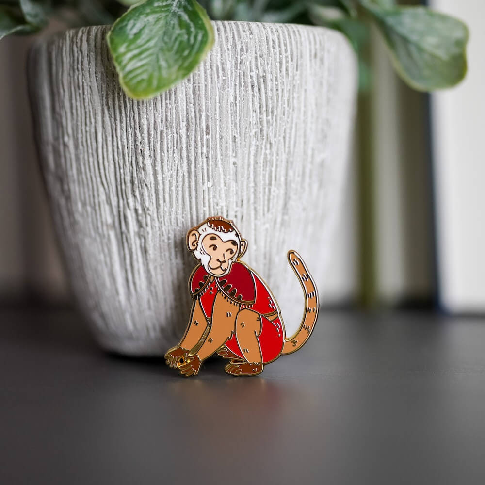 A Little Princess Monkey enamel pin sold by LitJoy