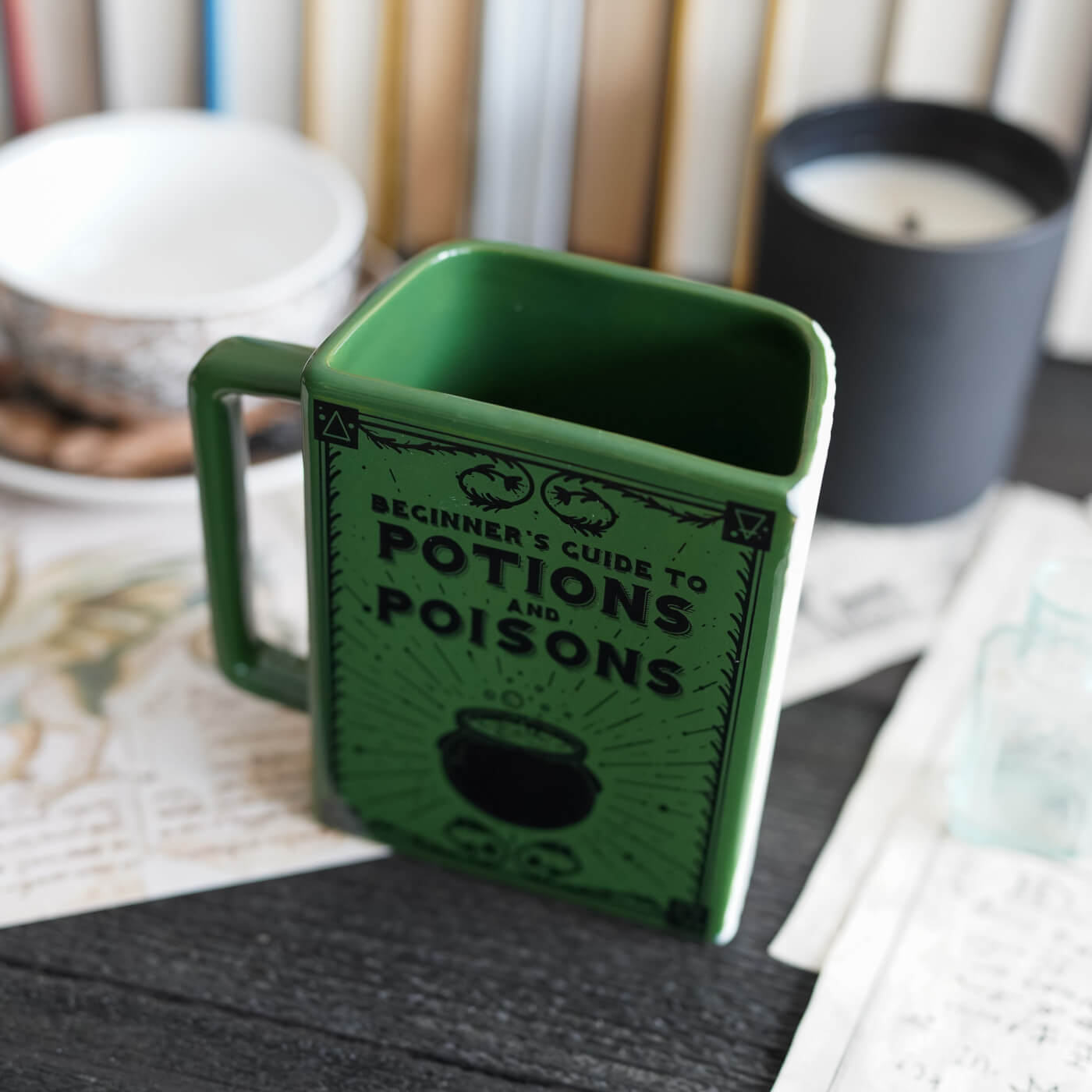 Potions and Poisons Book Mug sold by LitJoy a green mug that looks like a book with a handle