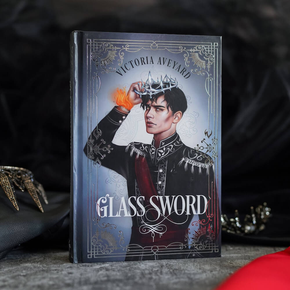 Tiberias Calore VII "Cal" on the cover of Glass Sword book 2 of the Red Queen series 