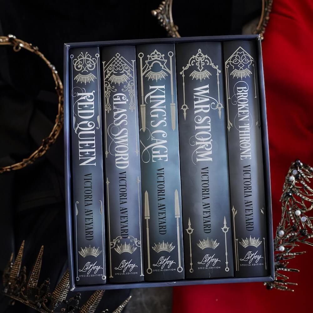 Red Queen Box Set with books in slipcase showing spines