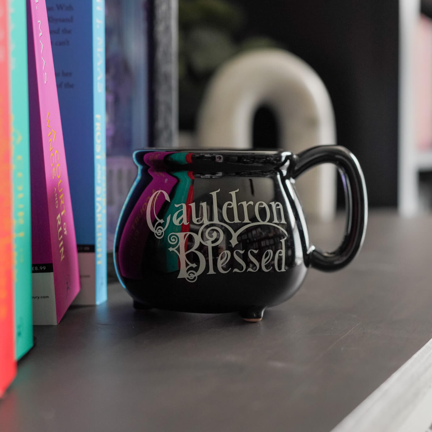 ACOTAR Cauldron replica as a mug that reads "Cauldron Blessed" in witchy script