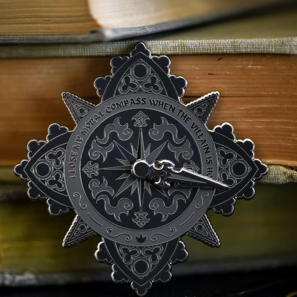 When the Villain Is Hot Enamel Pin with spinner like a compass reads "I lose my moral compass when the villain is hot"