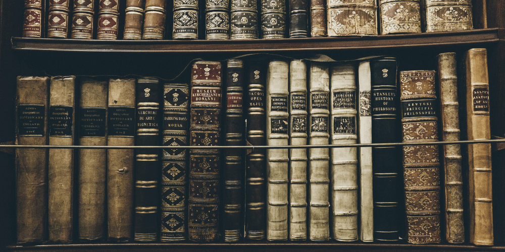old black and white books on a shelf