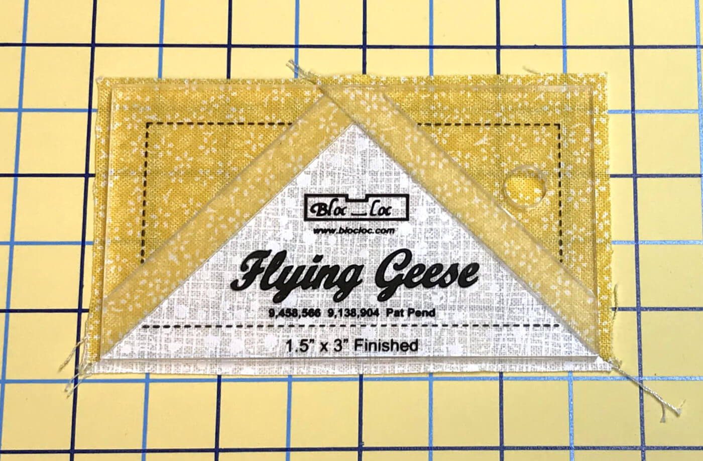 flying geese unit ready to trim with Bloc Loc ruler