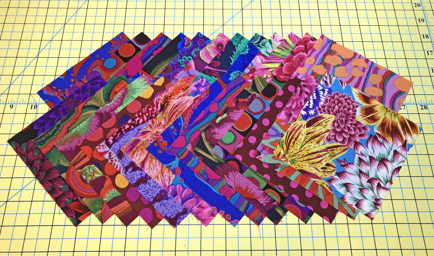 Kaffe Fassett fabric squares for charm square quilt pattern