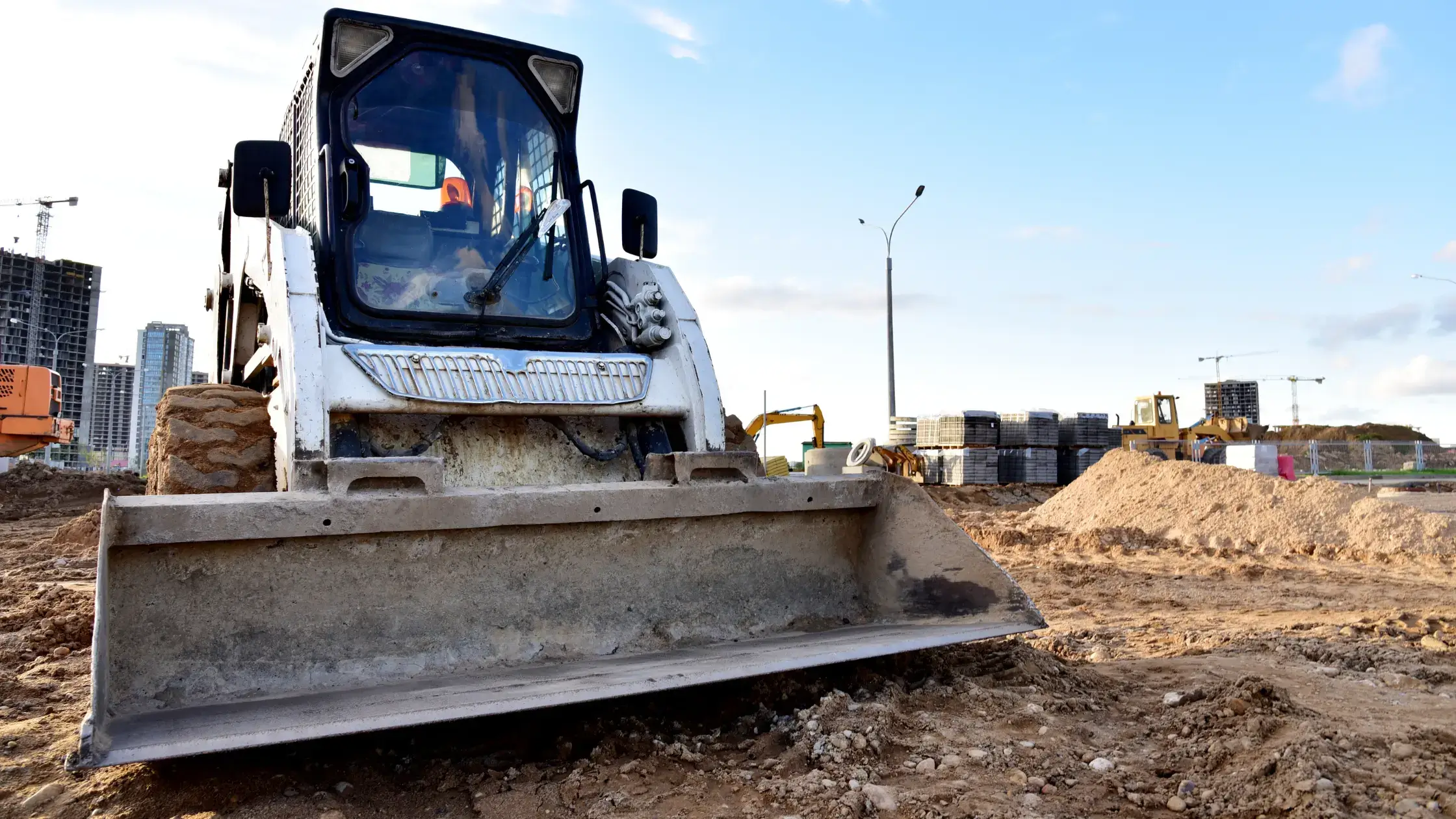 What Is A Skid Steer Attachment - Loading and Unloading Works on City Streets