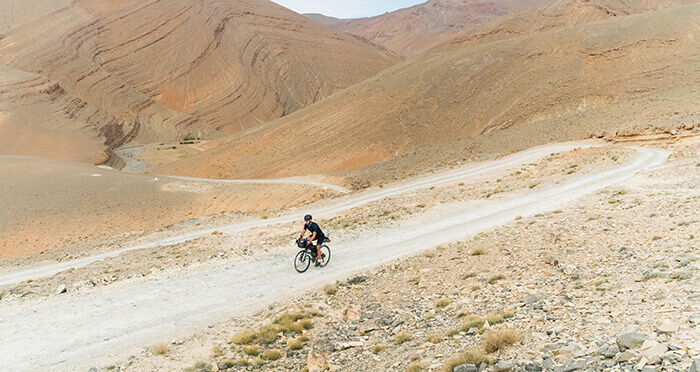 A man on a bike in the hills of Morocco