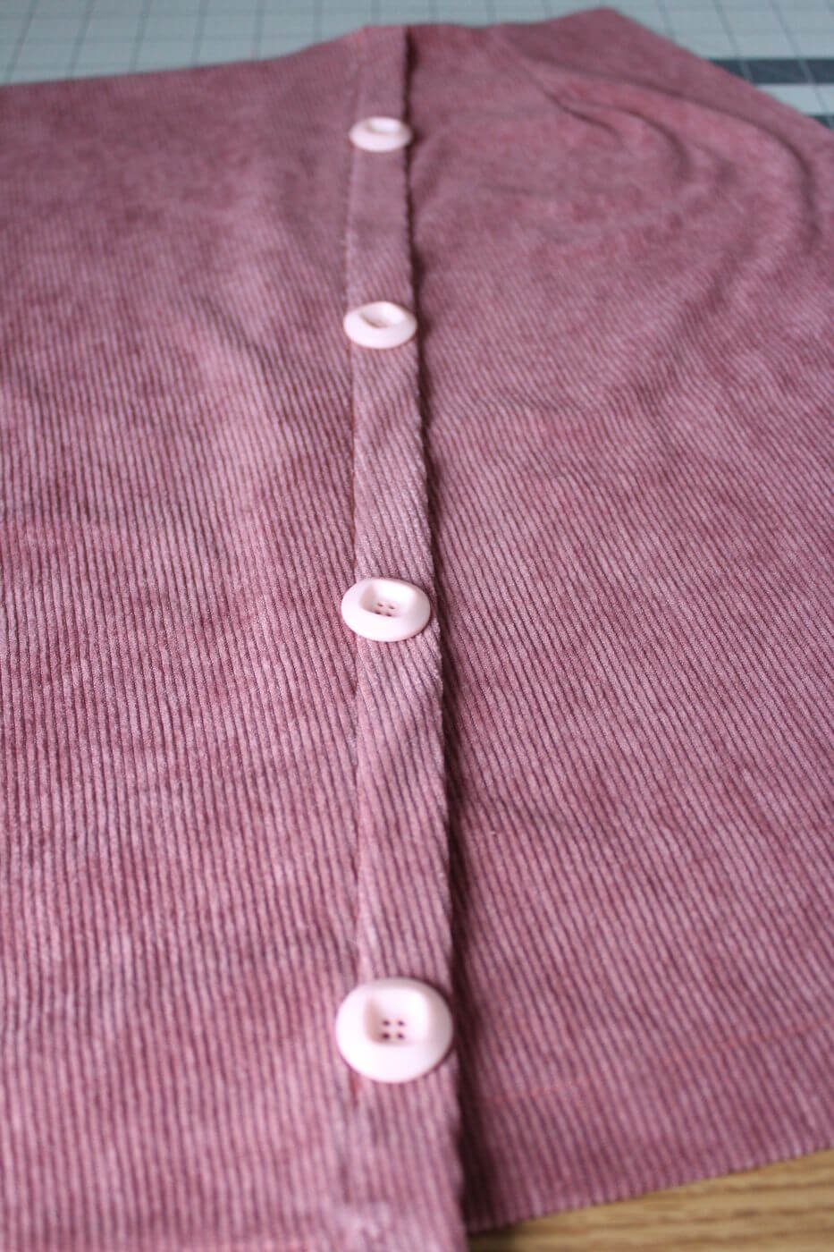 add buttons to your pleated skirt